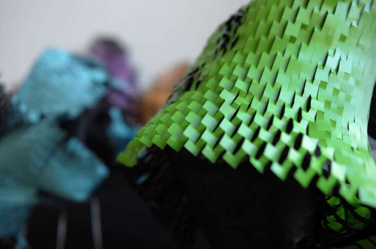 detail of green colours paper sculpture with spikes